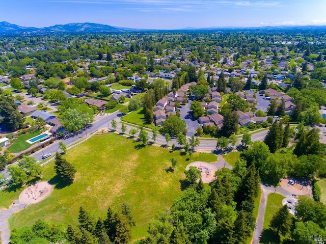 birds eye view of property featuring a mountain view and a residential view