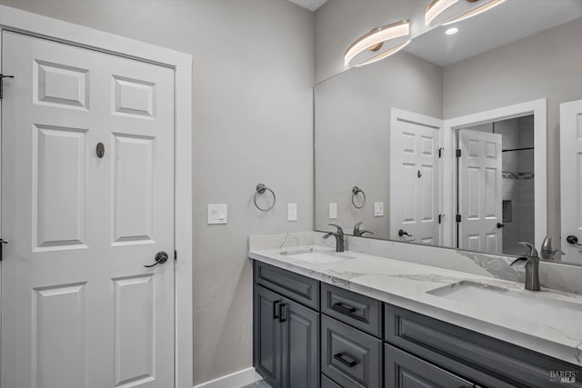 bathroom with double vanity and a sink