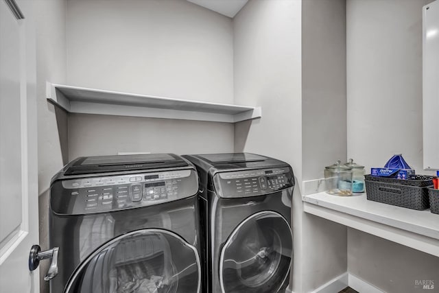 laundry area with washing machine and dryer and laundry area