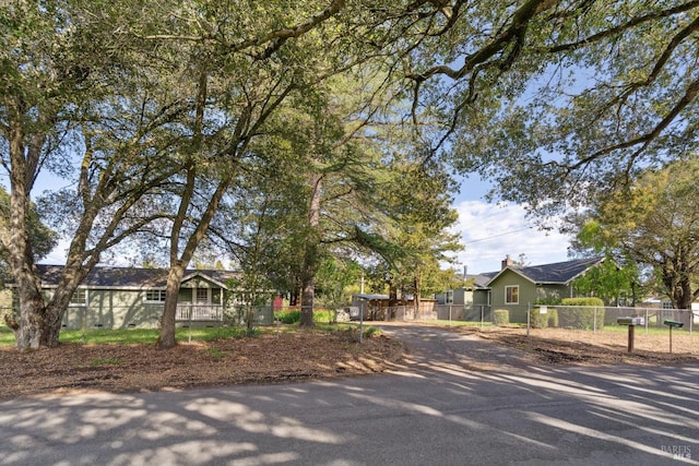 view of front of home featuring fence
