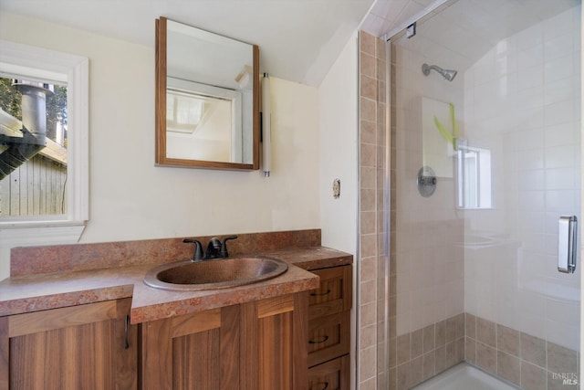 full bath with lofted ceiling, vanity, and a stall shower