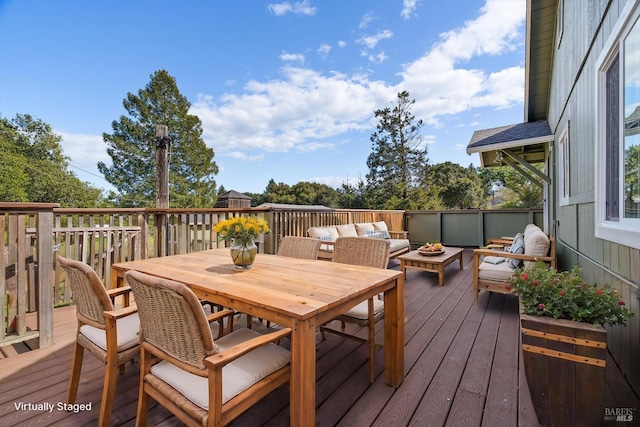 wooden terrace with outdoor lounge area