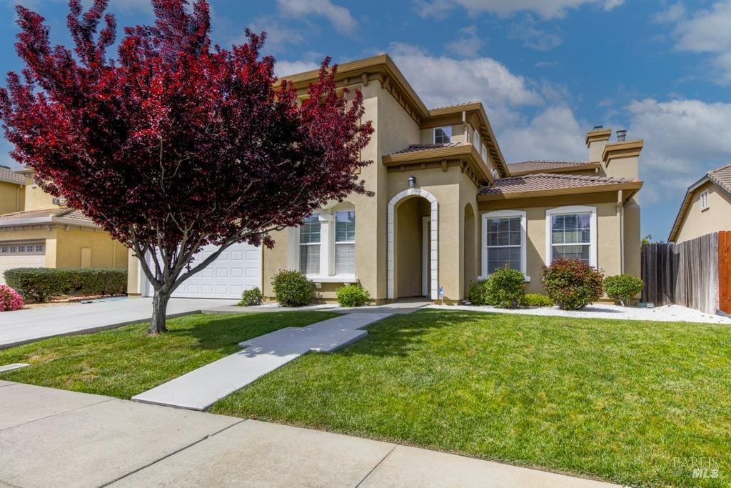 233 Sage Sparrow Cir, Vacaville, CA 95687 - mediterranean / spanish house with stucco siding, concrete driveway, and a chimney