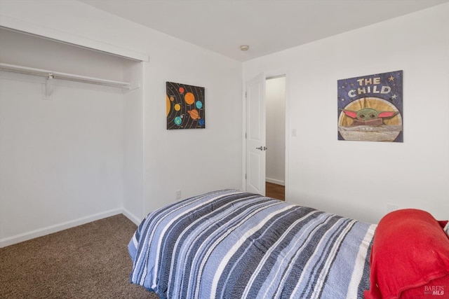 bedroom with carpet flooring and baseboards