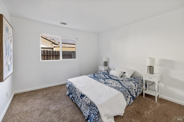 bedroom with visible vents, baseboards, and carpet flooring