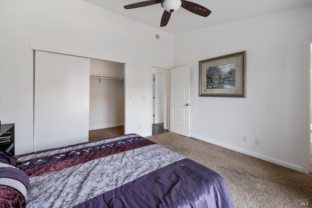carpeted bedroom with a closet, baseboards, a ceiling fan, and lofted ceiling