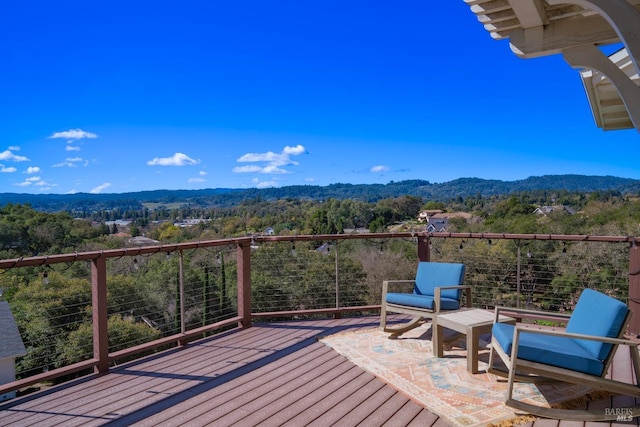 deck featuring a view of trees