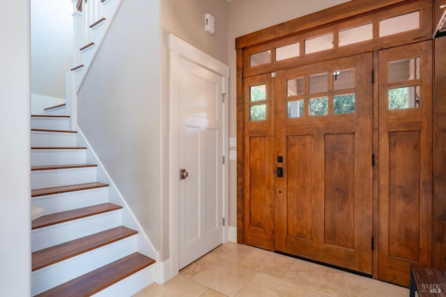 entryway with plenty of natural light and stairway
