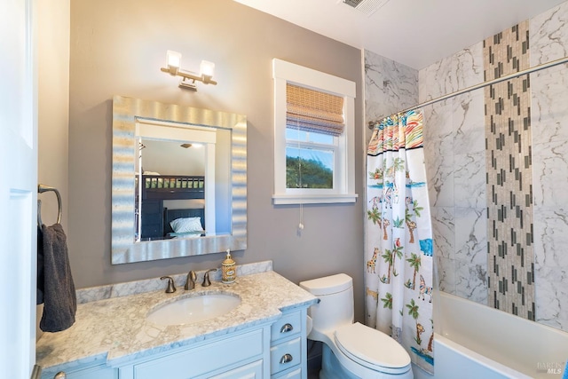 bathroom with vanity, toilet, shower / tub combo, and visible vents