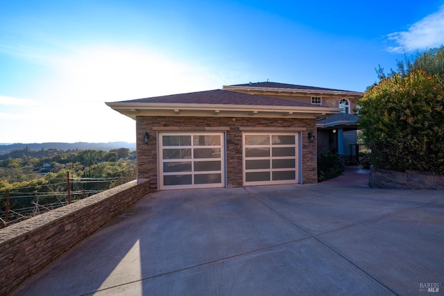 garage with concrete driveway