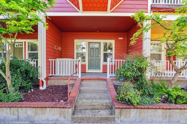doorway to property featuring covered porch