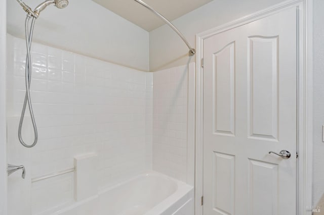 bathroom with bathing tub / shower combination