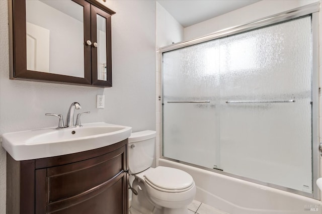 full bath with toilet, shower / bath combination with glass door, and vanity