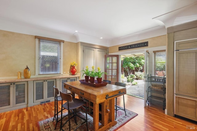dining room featuring wine cooler, light wood-style floors, and visible vents