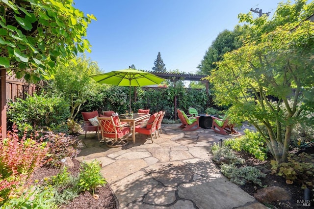 view of patio / terrace with outdoor dining space and fence