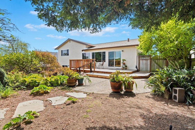 263 Carlisle Way, Benicia, CA 94510 - back of property with stucco siding, a deck, fence, and a gate