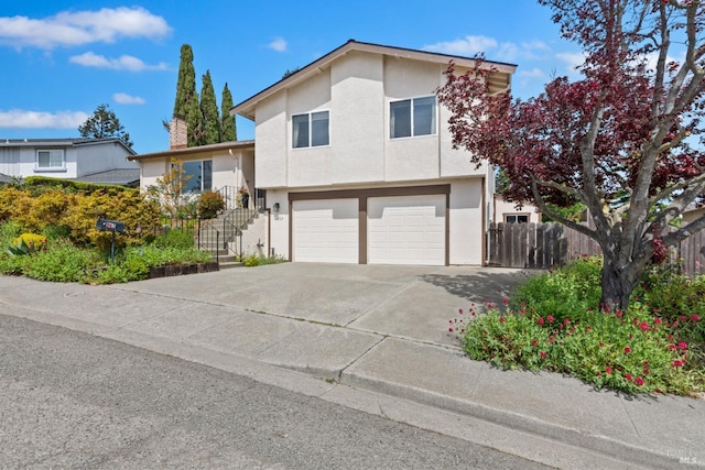 263 Carlisle Way, Benicia, CA 94510 - view of front of home featuring an attached garage, fence, a chimney, stucco siding, and concrete driveway