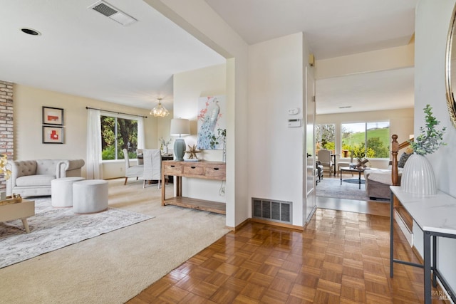 263 Carlisle Way, Benicia, CA 94510 - living room with healthy amount of natural light, baseboards, and a chandelier