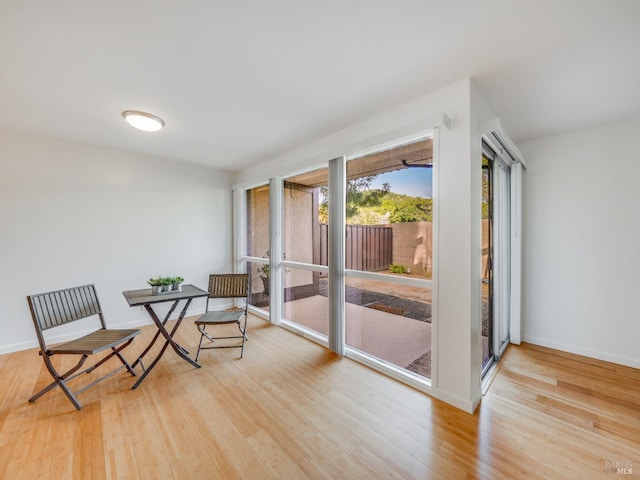 interior space featuring baseboards and wood finished floors