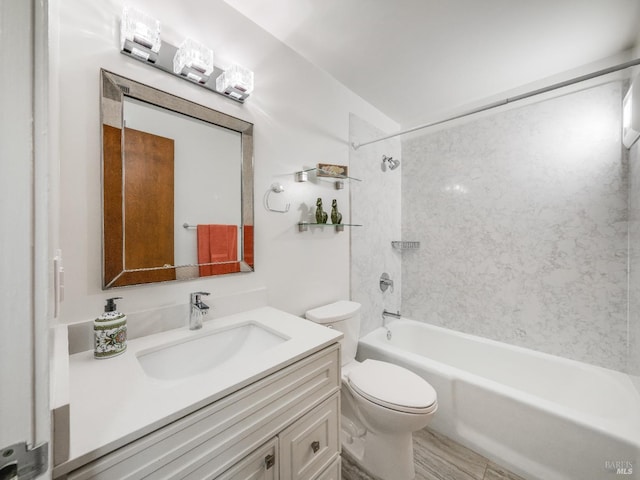 bathroom featuring shower / bath combination, vanity, and toilet