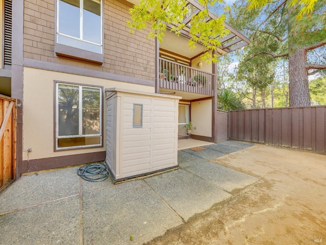 back of house featuring fence and a patio