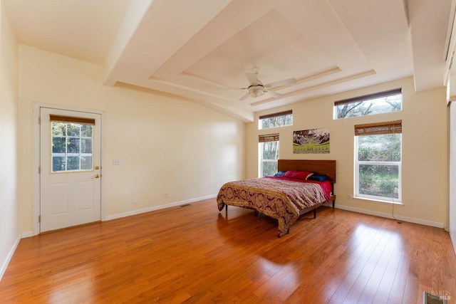 13679 Powerhouse Rd, Potter Valley, CA 95469 - bedroom featuring light wood-style flooring, a tray ceiling, baseboards, and visible vents