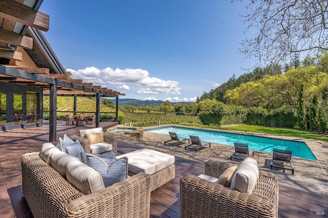 outdoor pool featuring outdoor lounge area and a pergola