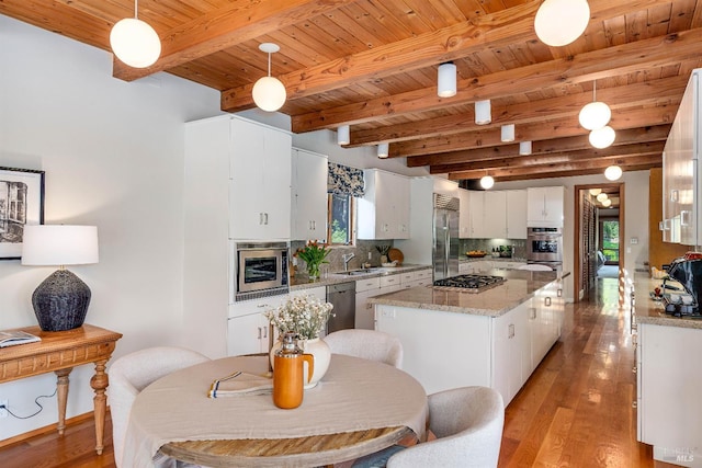 kitchen with light wood-style flooring, tasteful backsplash, white cabinets, wooden ceiling, and french doors