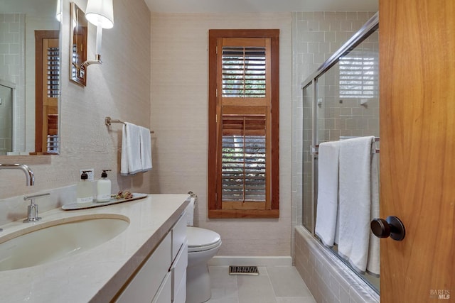 full bathroom with tile patterned floors, vanity, visible vents, and a healthy amount of sunlight