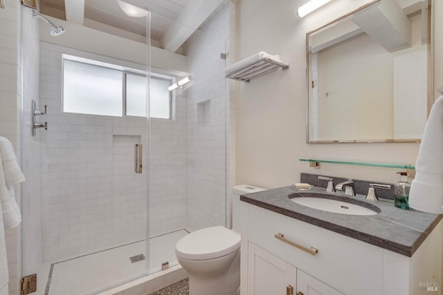 full bath with vanity, a stall shower, and toilet