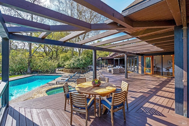 wooden deck featuring a pergola, an outdoor living space, outdoor dining area, and a mountain view