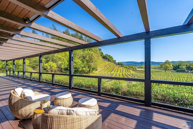 outdoor pool with a pergola, a deck, and an outdoor hangout area