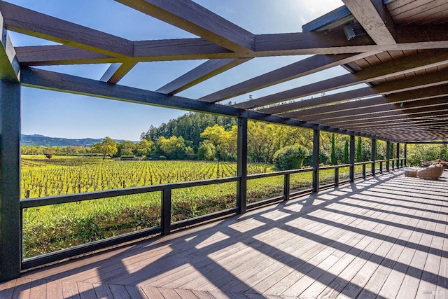 wooden deck featuring an outdoor pool and an outdoor hot tub