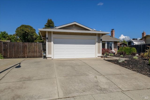 single story home featuring a chimney, fence, stucco siding, an attached garage, and driveway