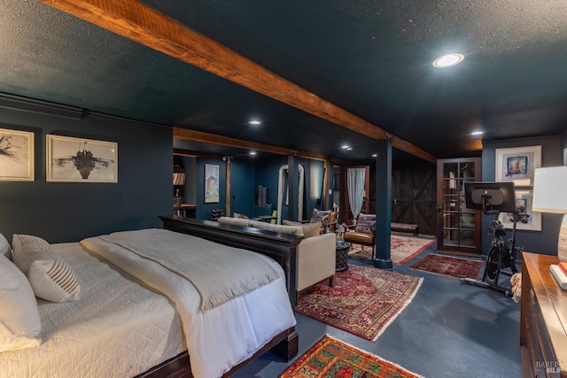 carpeted bedroom with recessed lighting and a textured ceiling