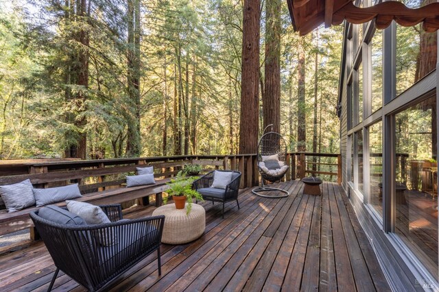 deck featuring a forest view