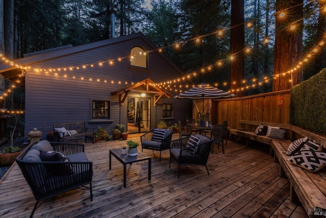 wooden terrace with outdoor lounge area