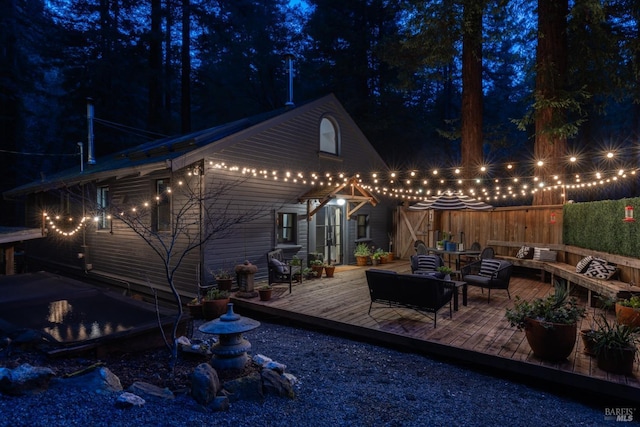 exterior space with outdoor lounge area and a wooden deck