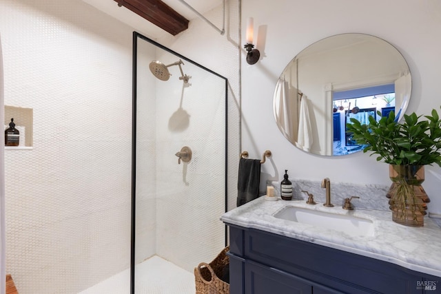 bathroom featuring walk in shower and vanity
