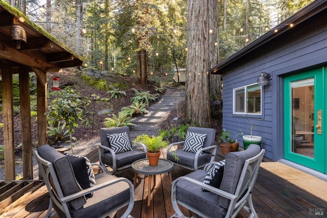 wooden terrace featuring an outdoor hangout area