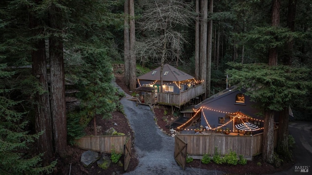 exterior space featuring a view of trees