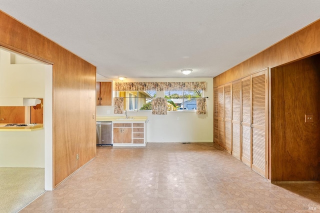 1740 Sereno Dr, Vallejo, CA 94589 - unfurnished living room with wooden walls, a sink, and light floors