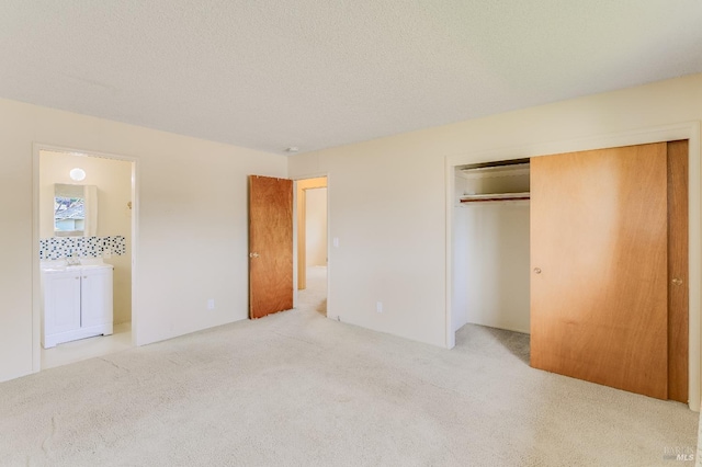 1740 Sereno Dr, Vallejo, CA 94589 - unfurnished bedroom with light carpet, a closet, a textured ceiling, and connected bathroom
