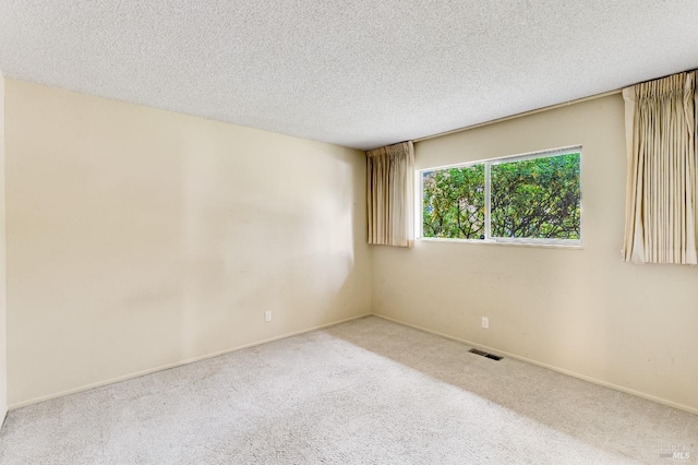 1740 Sereno Dr, Vallejo, CA 94589 - empty room featuring visible vents, baseboards, carpet, and a textured ceiling