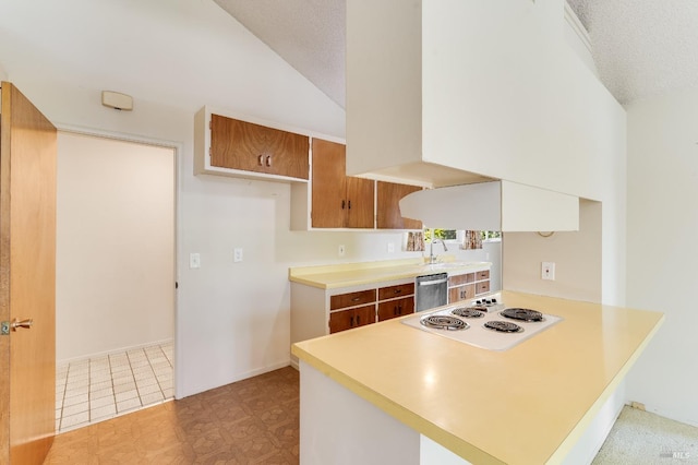1740 Sereno Dr, Vallejo, CA 94589 - kitchen with vaulted ceiling, white electric cooktop, a peninsula, light countertops, and stainless steel dishwasher