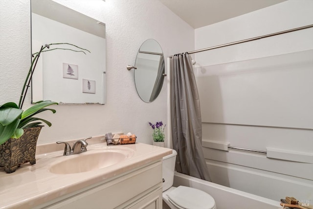 full bathroom with toilet, shower / bath combo, a textured wall, and vanity