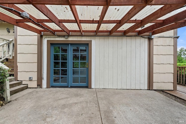 view of exterior entry featuring a patio area