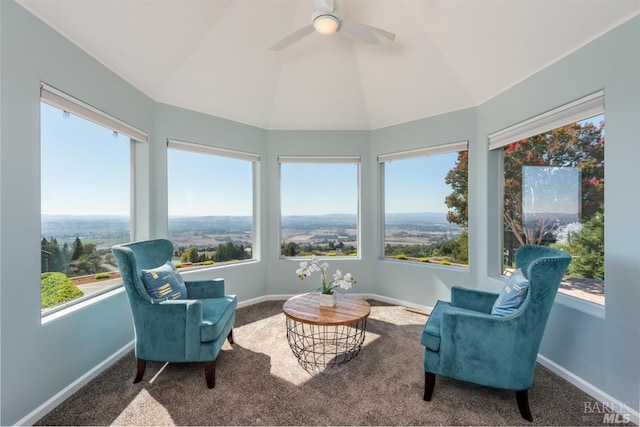 sunroom / solarium with carpet floors, vaulted ceiling, and a healthy amount of sunlight