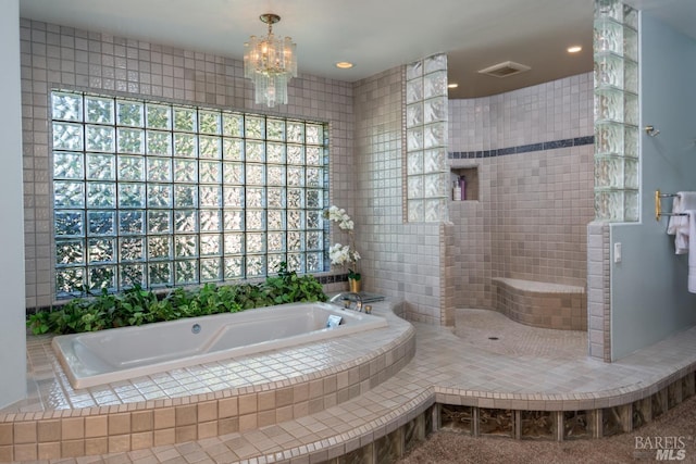 full bathroom featuring a walk in shower, an inviting chandelier, visible vents, and a bath