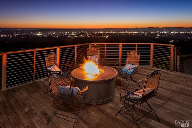 deck featuring an outdoor fire pit
